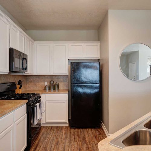 The Village at Creek Meadows model_kitchen-1 The Village at Creek Meadows; Two and Three Bedroom Pet Friendly Duplex Apartments for rent in College Station, TX near TAMU Texas A&M University
